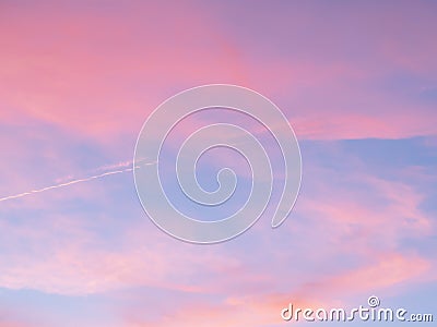 Soft, fluffy and colorful cloud formation. Abstract idyllic pink and blue sky. Blur background texture of colorful sunset clouds. Stock Photo