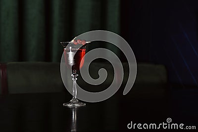Fresh alcoholic Cherry blossom cocktail on bar counter Stock Photo