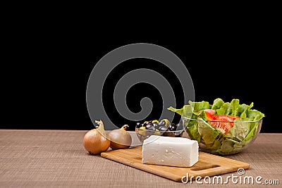 Fresh antipasto from feta cheese, onions and two glass bowls wit Stock Photo