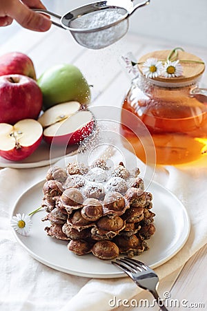 Fresh apple waffles with icing sugar and fresh apples breakfast, powdering with sugar Stock Photo