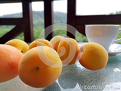 Fresh apricots scattered on the table. Stock Photo