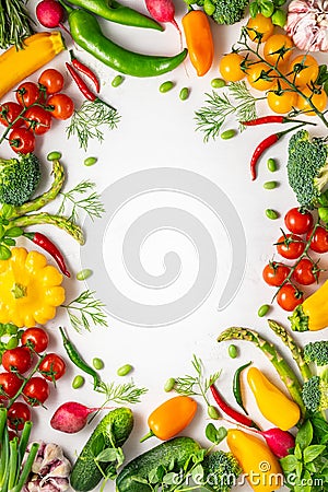 Fresh assorted vegetables and herbs on white background. Healthy clean eating, vegetarian or diet food concept.Food frame Stock Photo