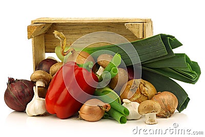 Fresh assorted vegetables in a wooden crate Stock Photo