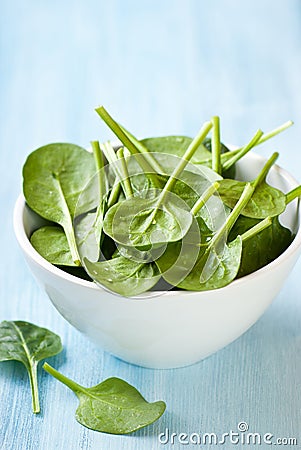 Fresh baby spinach in a small bowl Stock Photo