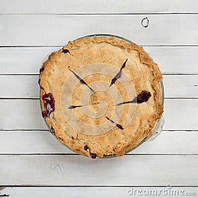 Fresh Baked Blackberry Pie that is Homemade and Messy on White or Gray Shiplap Board Background Table with a Square Crop and an ab Stock Photo