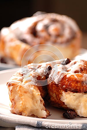 Fresh baked cinnamon buns with icing Stock Photo