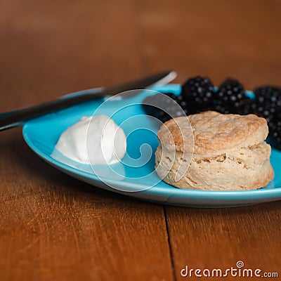 Fresh Baked Scone With Cream and Berry Jam Stock Photo