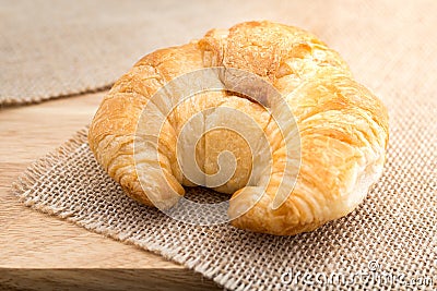 Fresh baked tasty croissants on brown napkin Stock Photo