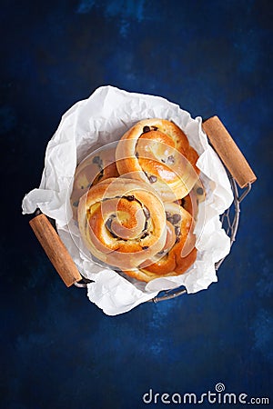 Fresh baked vanilla sweet sugar buns with chocolate drops Stock Photo