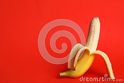 Fresh banana on red background. Sex concept Stock Photo