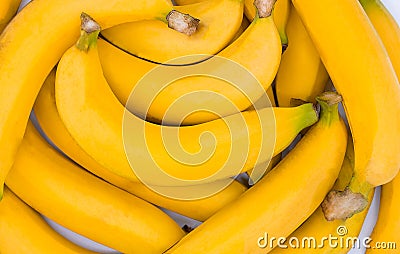 Fresh banana yellow background,Closeup of a bundle of bananas Stock Photo