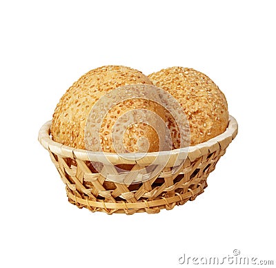 A fresh basket of golden brown hard crusted buns. Shot on white background Stock Photo