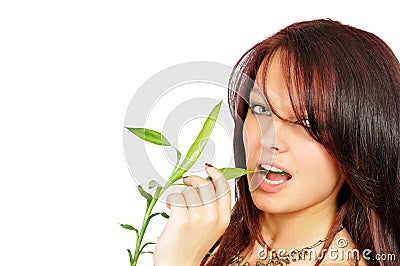 Fresh beatiful girl bites a bamboo Stock Photo