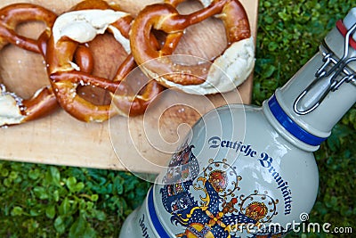 Fresh beer mug and pretzel from German Oktoberfest Stock Photo