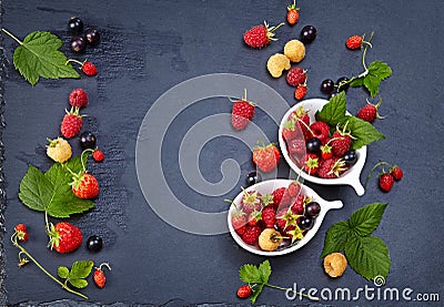 Fresh Berries on Slate Background (Strawberries, Raspberries and Stock Photo