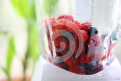 Fresh berry mix in blender Stock Photo