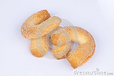 Fresh biscuit cookies in the form of bagels, sprinkled with sugar, on a white background Stock Photo