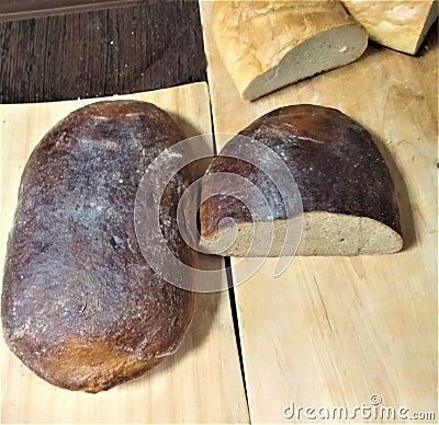 Fresh black bread from rye flour, is also cut long loaf of white loaf, Belarus, agriculture the vegetarian Stock Photo