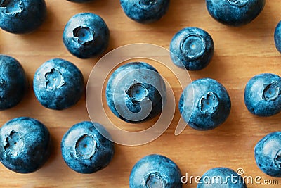 Fresh blueberry on a wooden table. Top view. Fresh bilberry closeup. Stock Photo