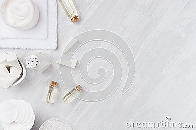 Fresh body and skin care spa cosmetics collection and natural bath accessories on white wood background, top view, border. Stock Photo