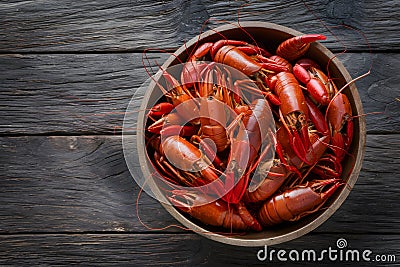 Fresh boiled crawfish on rustic wooden background, culinary delight Stock Photo