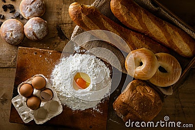 Fresh bread image. Breads,baguettes,bagels and flour with some eggs. Stock Photo