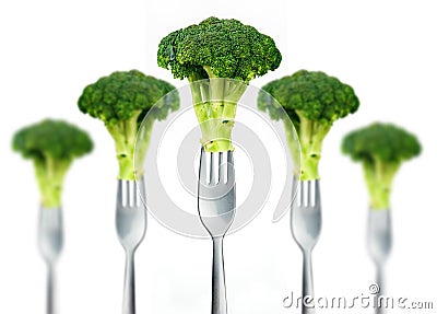 Fresh broccoli on fork isolated on white Stock Photo