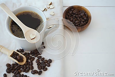 Fresh bubble hot black coffee in pure white ceramic cup on white wooden table, coffee love concept, copy space Stock Photo