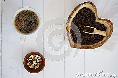 Fresh bubble hot black coffee in pure white ceramic cup on white wooden table, coffee love concept, copy space Stock Photo
