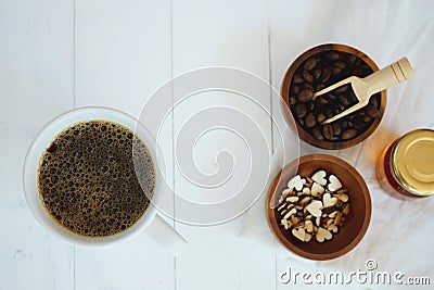 Fresh bubble hot black coffee in pure white ceramic cup on white wooden table, coffee love concept, copy space Stock Photo
