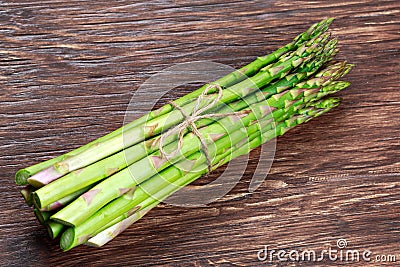 Fresh bunch asparagus on wooden table background Stock Photo