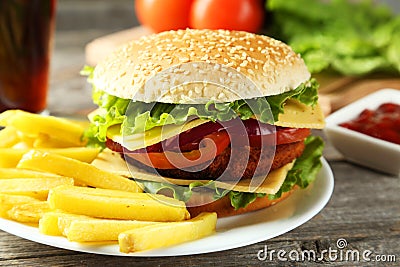Fresh burgers on plate on a grey wooden background Stock Photo