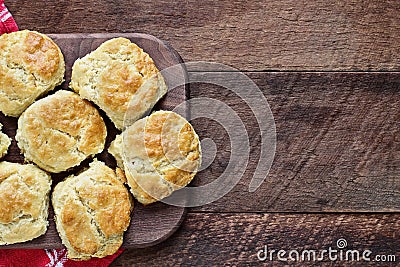 Buttermilk Southern Biscuits on Cutting Board Over Rustic Wood Table Stock Photo