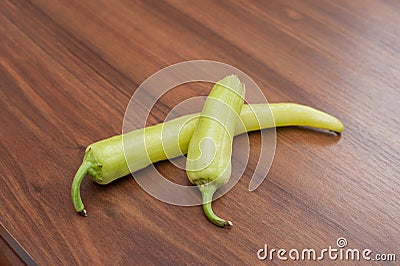 Fresh cayenne green pepper on wooden table Stock Photo