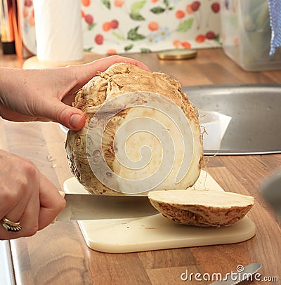 Fresh Celeriac Beeing Cut Stock Photo