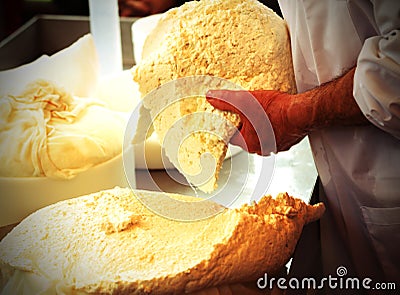Fresh cheese just made in the old dairy in a mountain hut Stock Photo