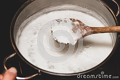 Fresh cheese making process, clotted cheese in a saucepan Stock Photo