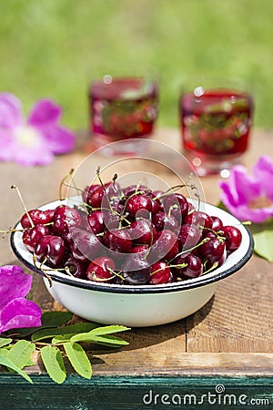 Fresh cherries in bowl Stock Photo