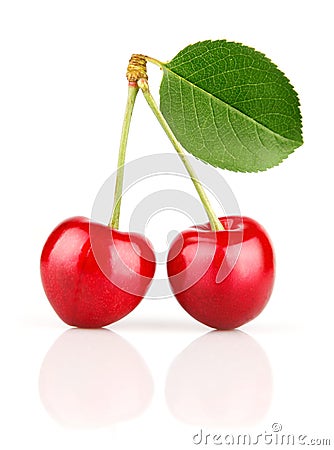 Fresh cherry fruits with green leaves Stock Photo