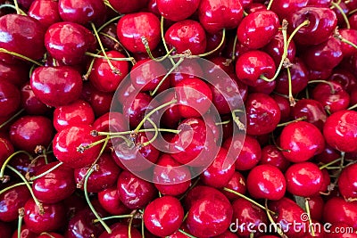 Fresh cherry stand at a street organic food market. Stock Photo