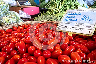 Fresh cherry tomatoes at the local market. Mexican sugar flavored Mexican tomato sale price: 20 kilograms per kilogram Editorial Stock Photo