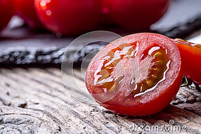 Fresh cherry tomatoes. Ripe tomatoes on oak wooden background Stock Photo