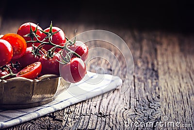 Fresh cherry tomatoes. Ripe tomatoes on oak wooden background Stock Photo