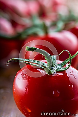 Fresh cherry tomatoes washed clean water. Cut fresh tomatoes Stock Photo