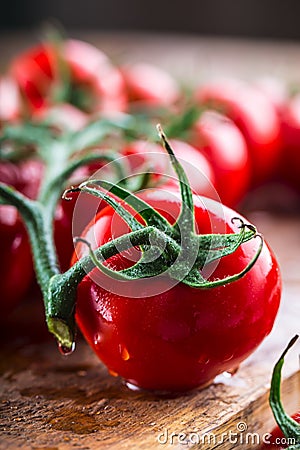 Fresh cherry tomatoes washed clean water. Cut fresh tomatoes Stock Photo