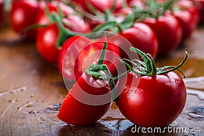 Fresh cherry tomatoes washed clean water. Cut fresh tomatoes Stock Photo