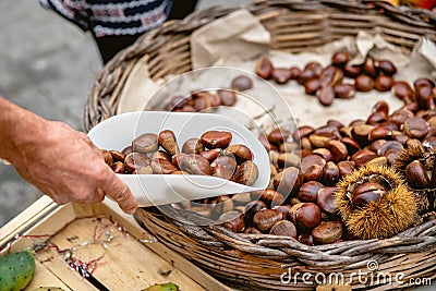Fresh chestnuts in Ortigia fresh food street market. Syracuse, Sicily, Italy Stock Photo