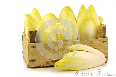 Fresh chicory in a wooden crate Stock Photo