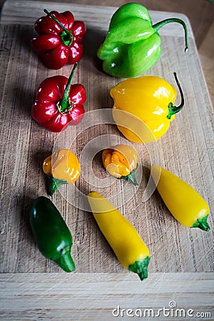 Fresh chilies on wood chopping board #3 Stock Photo