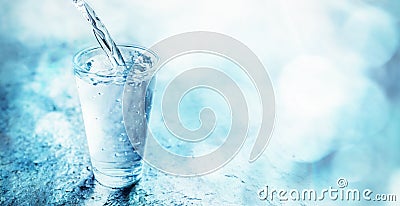 Fresh clean water pouring into a glass Stock Photo